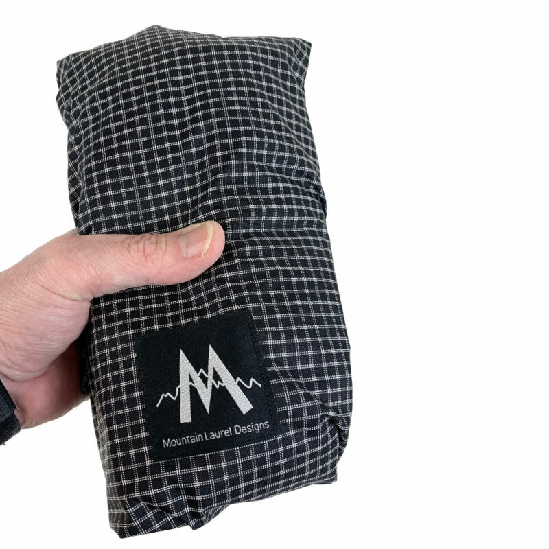 The MLD Core folded and held in the hand. It is slightly larger than a soda can. This pack is compact/packable.
