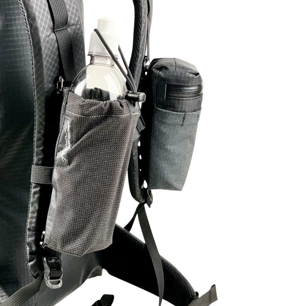 Bottle Pocket and Gear Pocket on Shoulder Straps. Water bottle pocket in foreground.