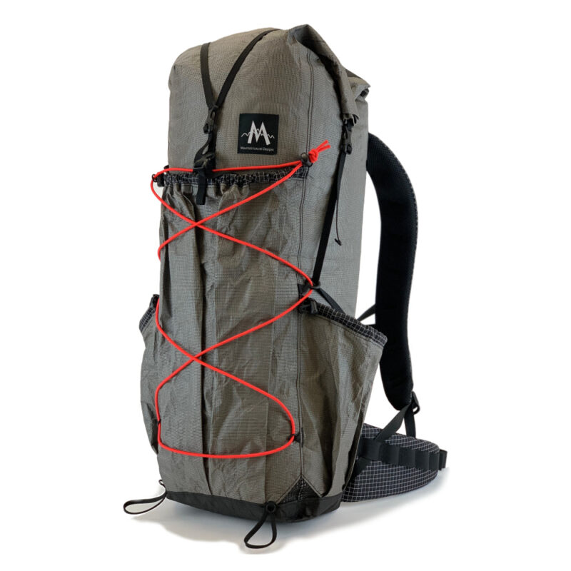 The MLD Burn 38L backpack in Ultra 200/400 with Red bungee cord