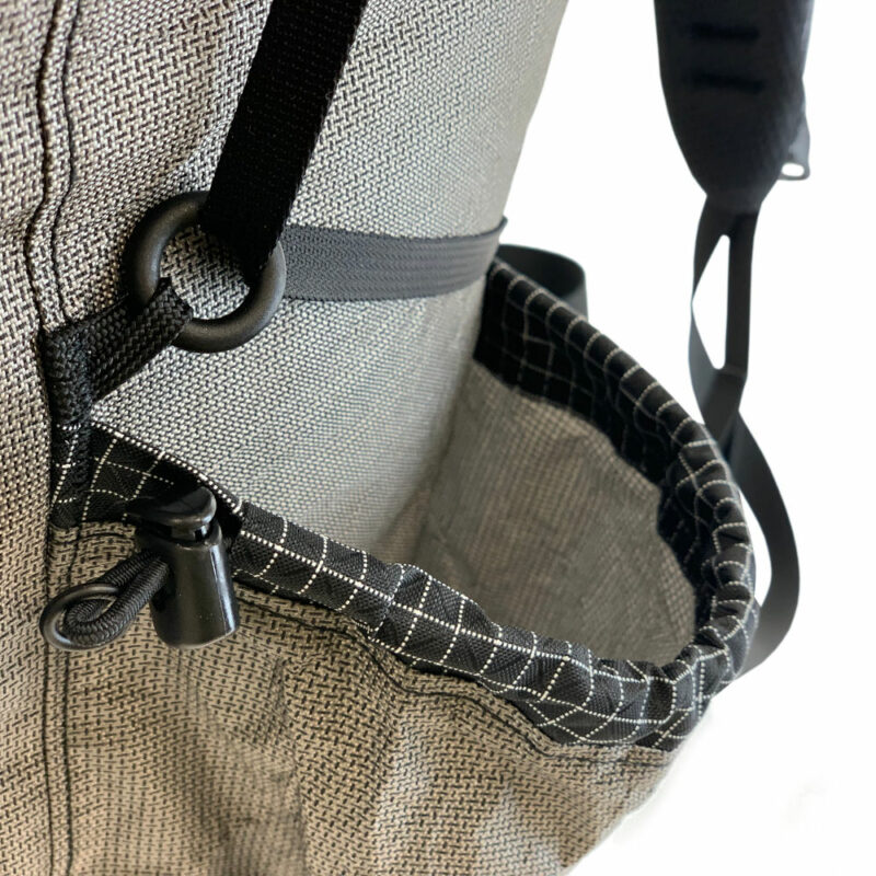 The side pocket, side pocket cinch cord, and compression strap on the MLD Prophet EcoPak Ultra