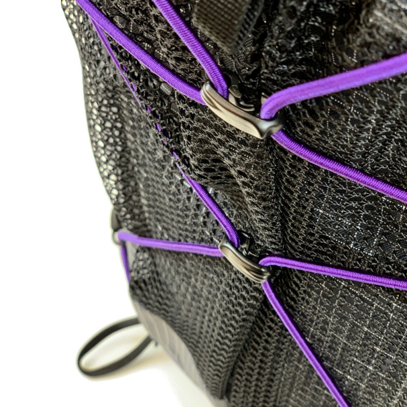 A Close Up of the Connector Sliders on a purple bungee cord on an MLD pack