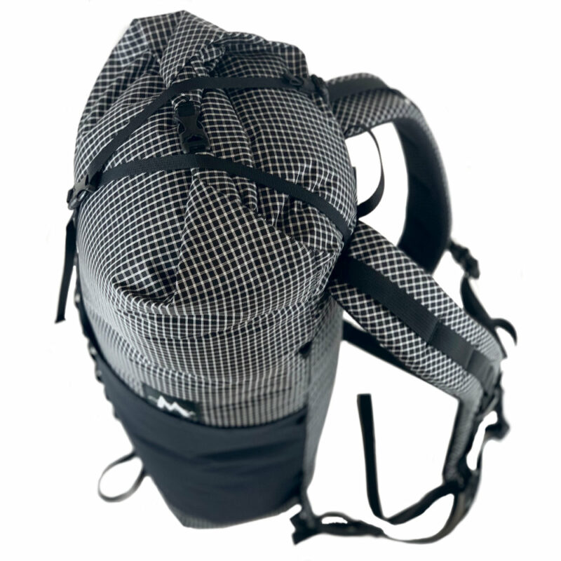 A top down view of the MLD Hell 27Lpack showing compression stop, haul loop, and rolltop.