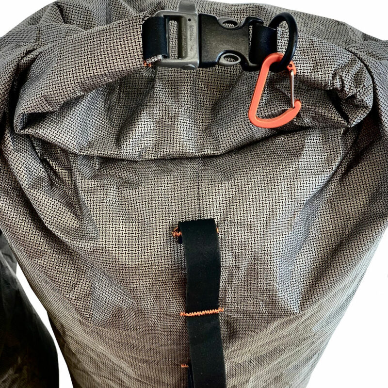 A top view of the Ultra 200 X Bike Dry Bag showing the roll-top, buckle with built-in whistle, and d-ring holding the caribiner. The daisy chain is visible along the side of the pack.