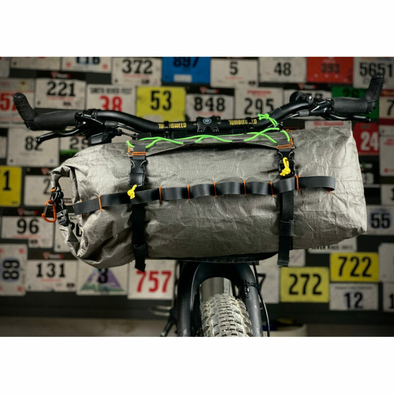 An Ultra 200 X Bike Dry Bag on the front of a bike using the MLD Border Handlebar Harness System